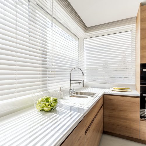 Kitchen with white window blinds